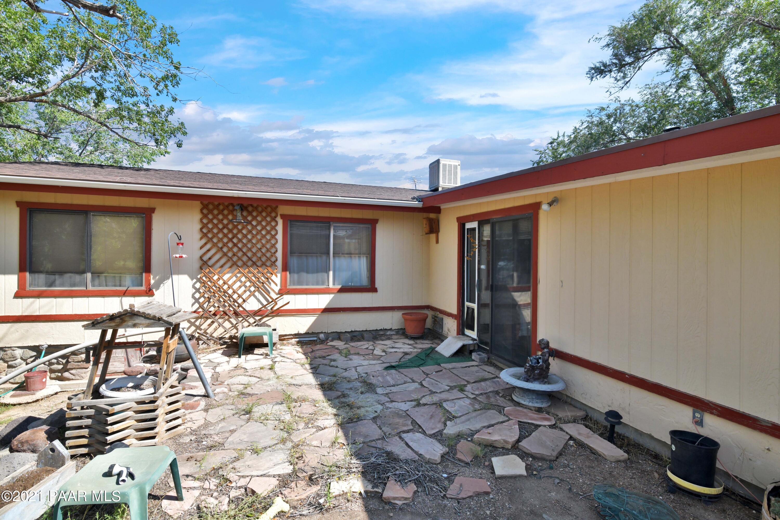 3250 North Reed Road Chino Valley, AZ 86323 - Photo 5 of 40 a front view of a house with patio