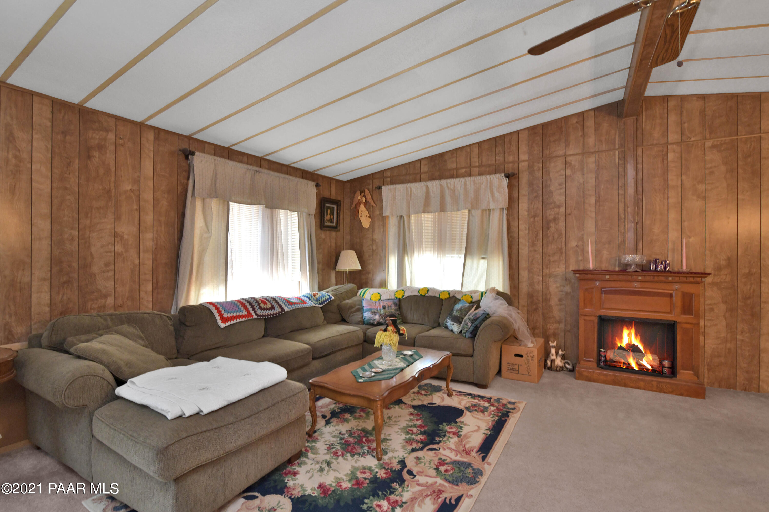 3250 North Reed Road Chino Valley, AZ 86323 - Photo 7 of 40 a living room with furniture and a fireplace