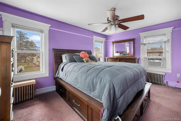 a bed room with a bed and a window