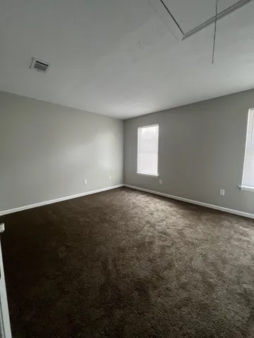 an empty room with a empty space and window