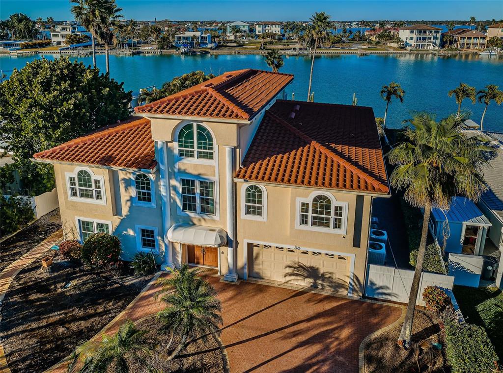 an outdoor space with furniture and city view