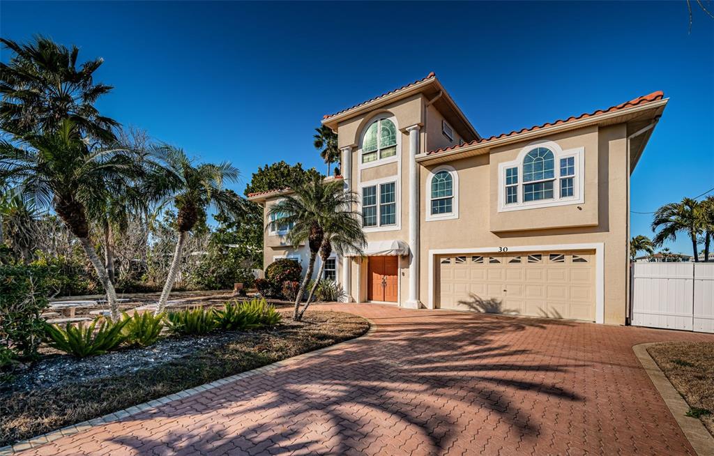 30 Dolphin Drive Treasure Island, FL 33706 - Photo 11 of 71 a front view of a house with a yard