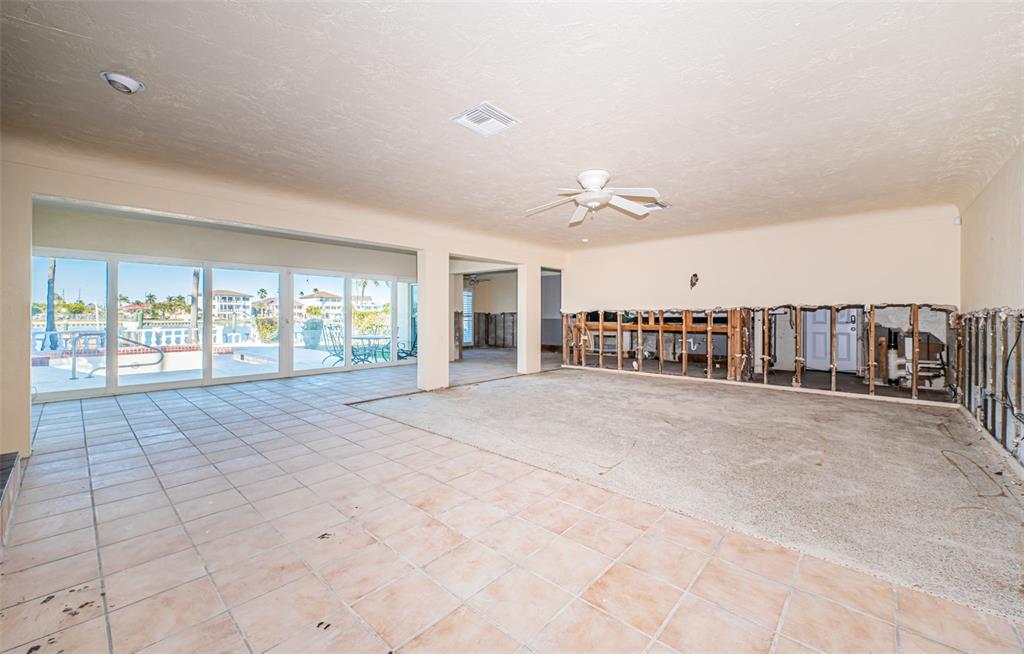 30 Dolphin Drive Treasure Island, FL 33706 - Photo 17 of 71 a view of an empty room with chandelier