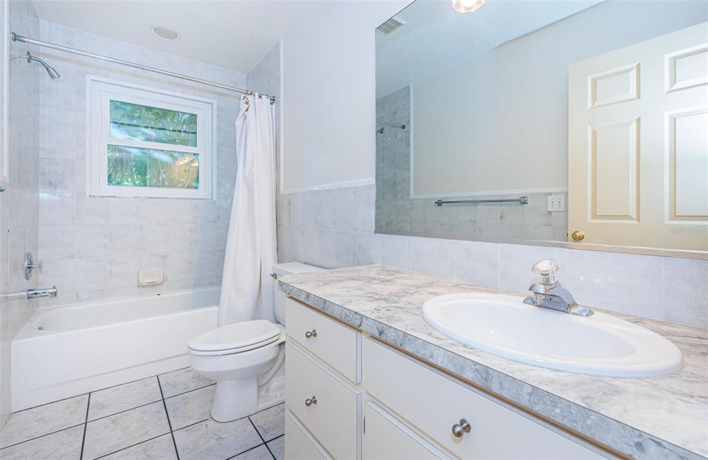 30 Dolphin Drive Treasure Island, FL 33706 - Photo 34 of 71 a bathroom with a sink toilet and shower