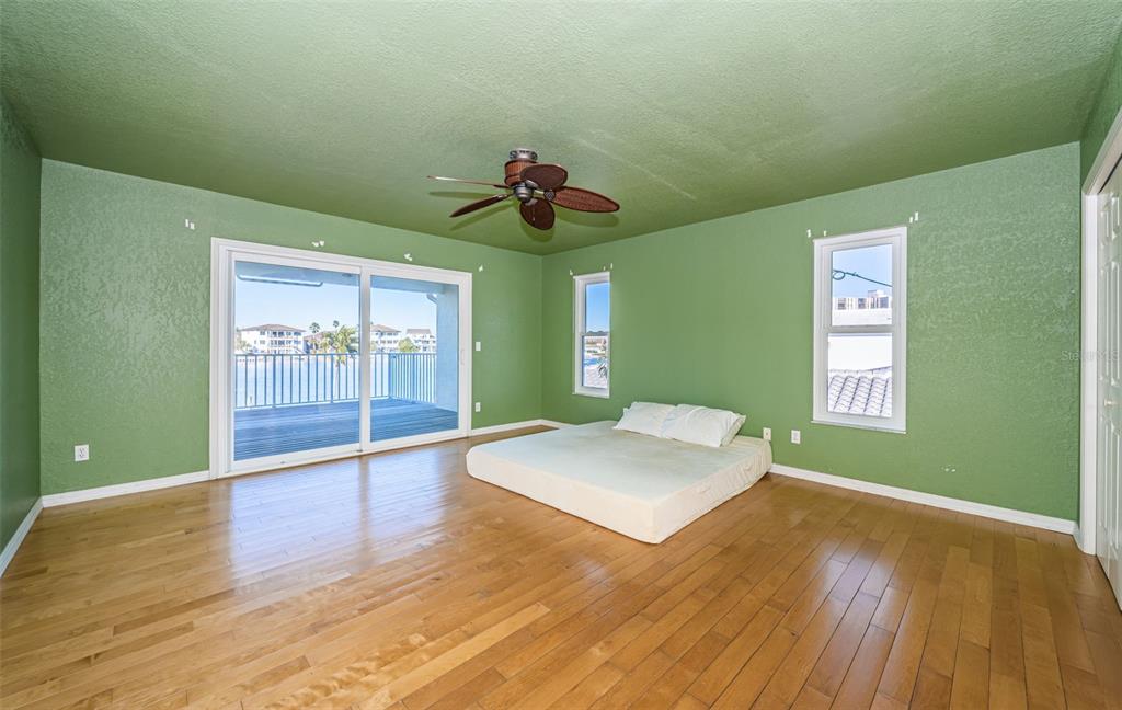 30 Dolphin Drive Treasure Island, FL 33706 - Photo 35 of 71 a view of an empty room with window and wooden floor