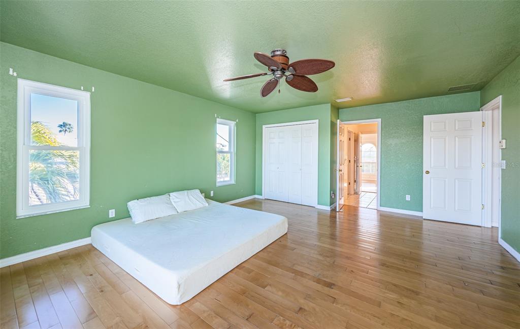 30 Dolphin Drive Treasure Island, FL 33706 - Photo 38 of 71 a view of an empty room with window and wooden floor