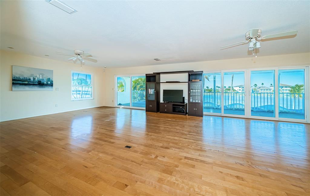 30 Dolphin Drive Treasure Island, FL 33706 - Photo 45 of 71 a view of empty room with wooden floor and fireplace