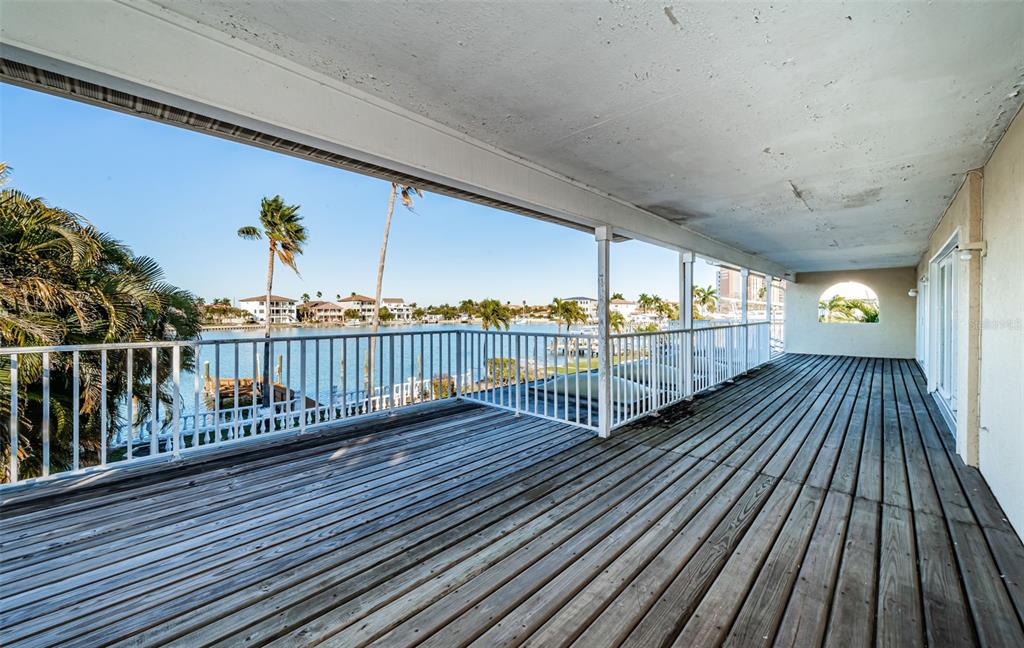30 Dolphin Drive Treasure Island, FL 33706 - Photo 46 of 71 a view of a balcony with wooden floor