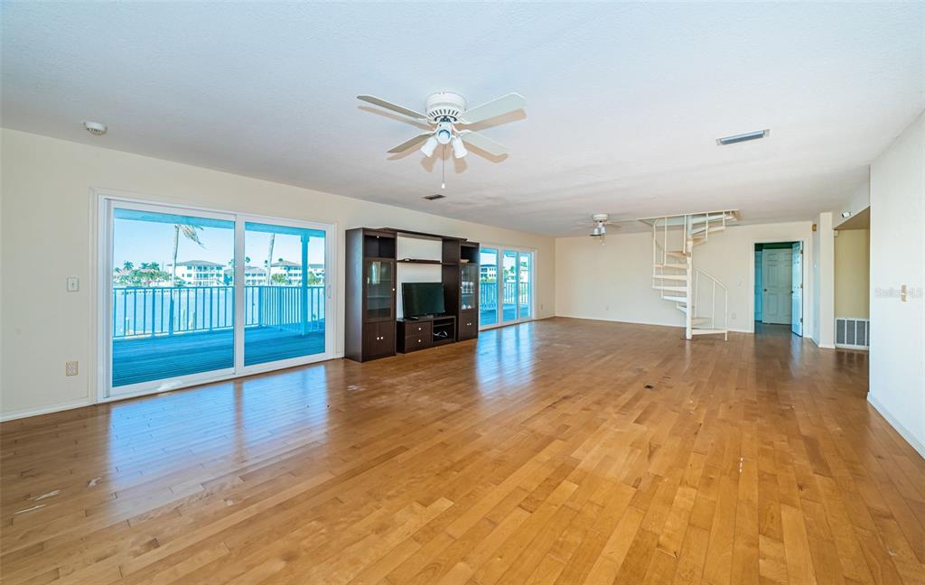30 Dolphin Drive Treasure Island, FL 33706 - Photo 50 of 71 a view of empty room with wooden floor and fan
