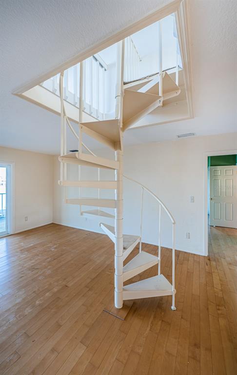30 Dolphin Drive Treasure Island, FL 33706 - Photo 52 of 71 an empty room with wooden floor and windows