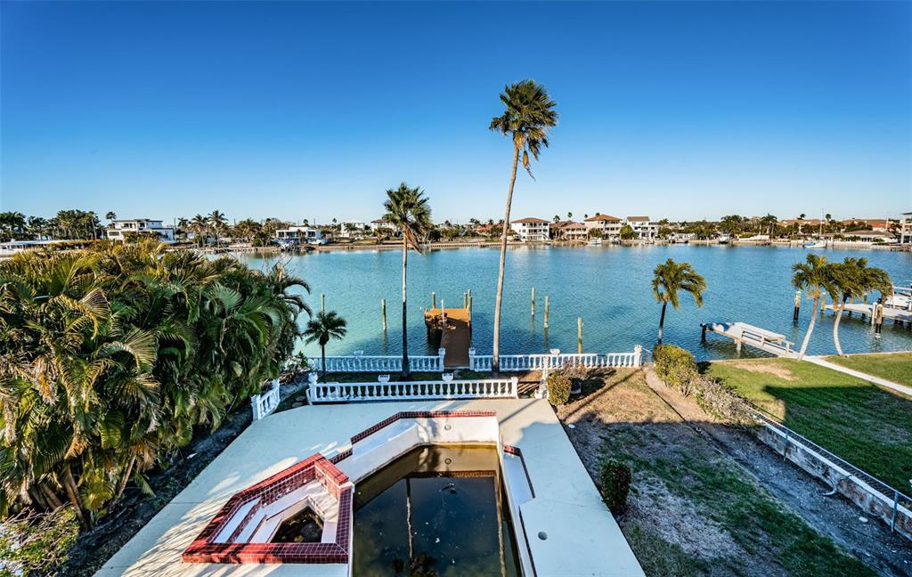 30 Dolphin Drive Treasure Island, FL 33706 - Photo 55 of 71 a view of a lake with couches chairs