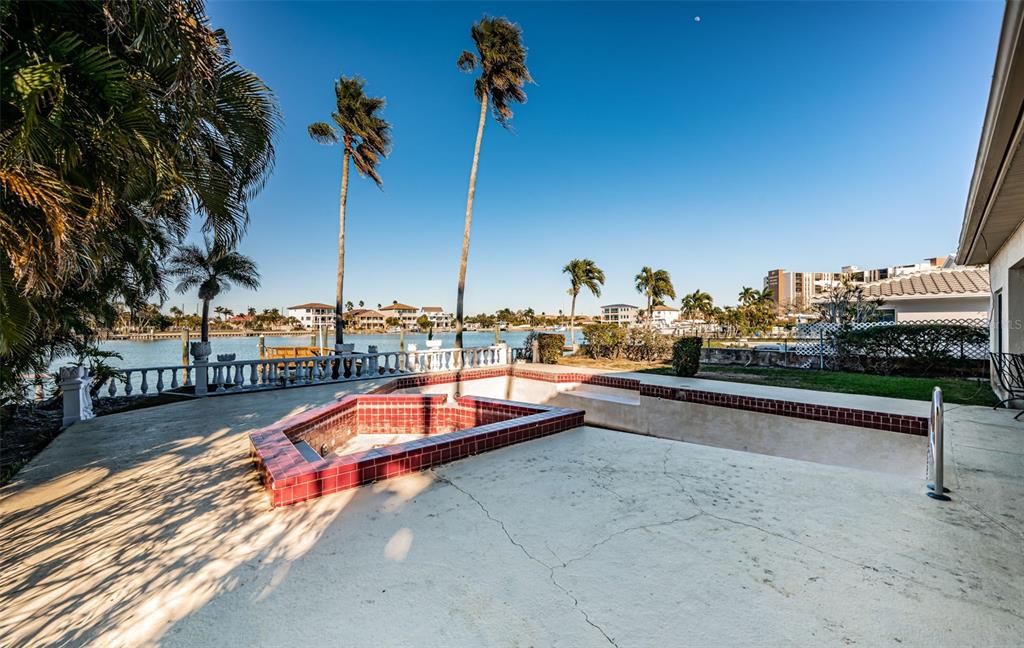 30 Dolphin Drive Treasure Island, FL 33706 - Photo 59 of 71 a view of a swimming pool with a lounge chair
