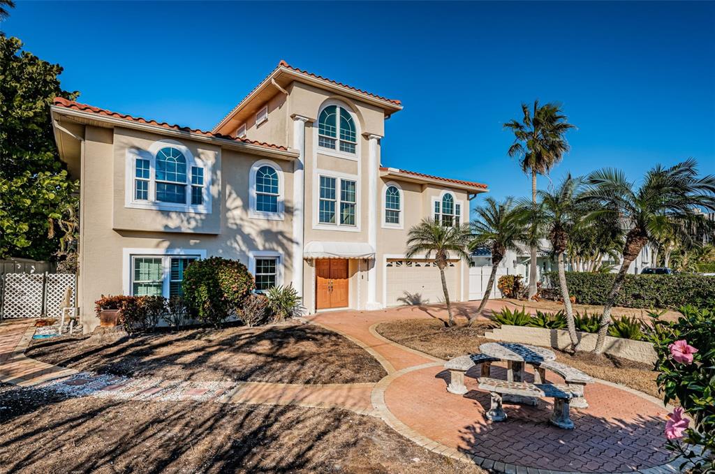 30 Dolphin Drive Treasure Island, FL 33706 - Photo 6 of 71 a front view of a house with a tree