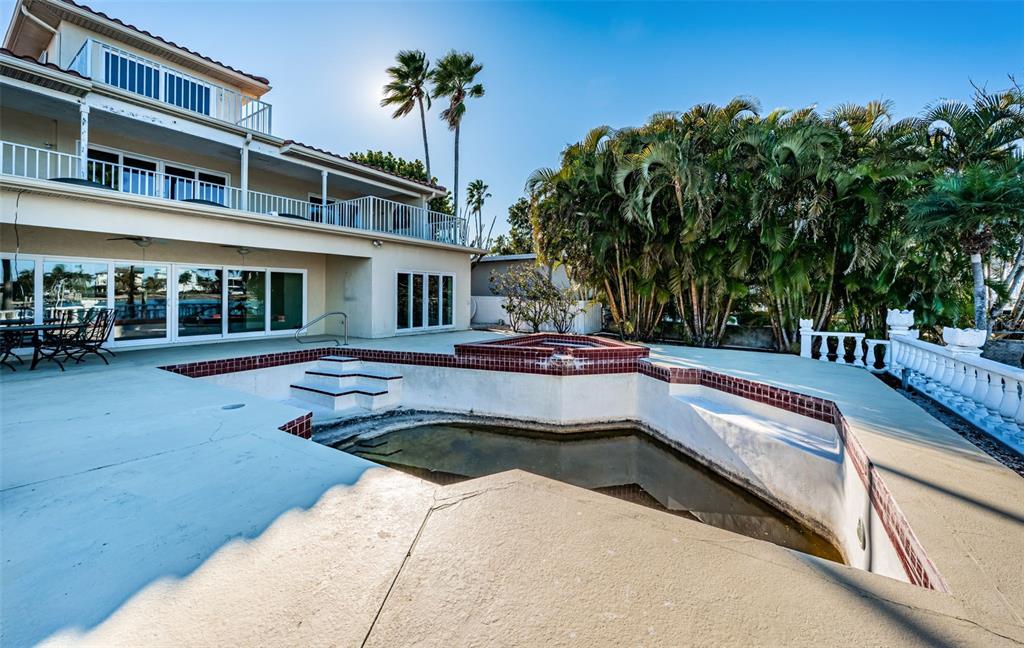 30 Dolphin Drive Treasure Island, FL 33706 - Photo 61 of 71 a swimming pool with outdoor seating and yard
