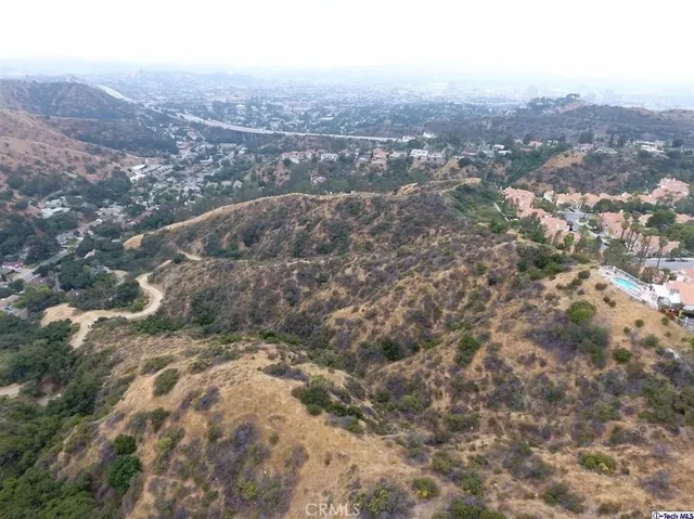 an aerial view of residential house and green space