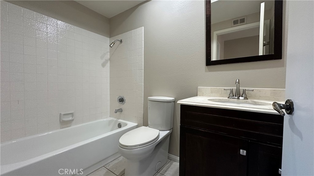 19526 Turtle Ridge Lane Porter Ranch, CA 91326 - Photo 19 of 27 a bathroom with a sink toilet a bathtub and a mirror