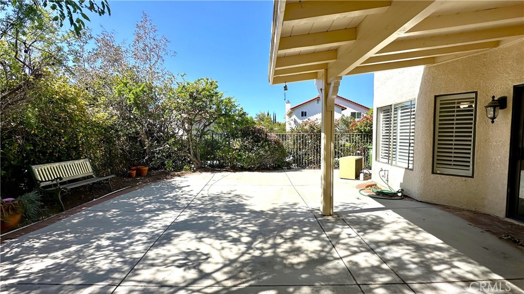 19526 Turtle Ridge Lane Porter Ranch, CA 91326 - Photo 21 of 27 a view of a porch with a bench