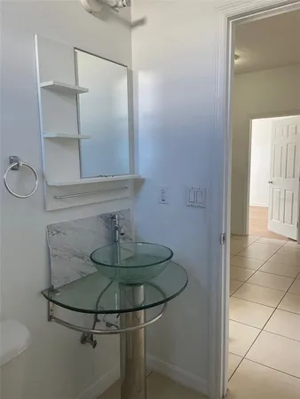 a bathroom with a mirror and a shower