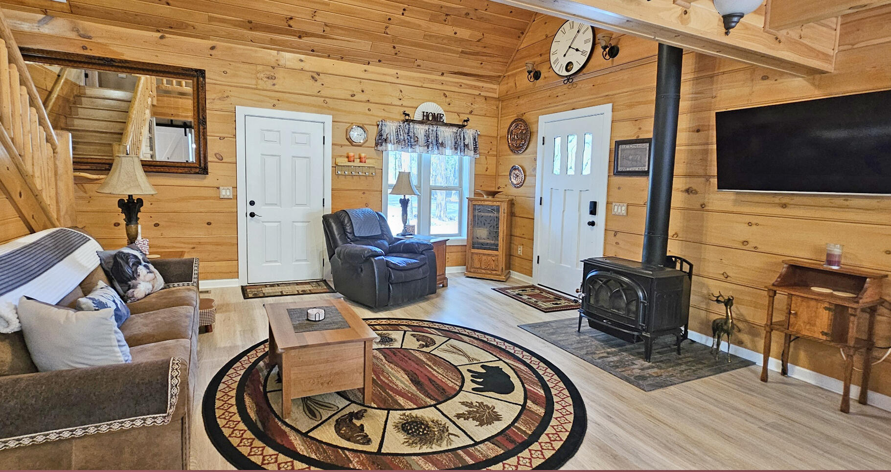 17659 Rosland Road La Pine, OR 97739 - Photo 11 of 33 a living room with furniture a flat screen tv and floor to ceiling window