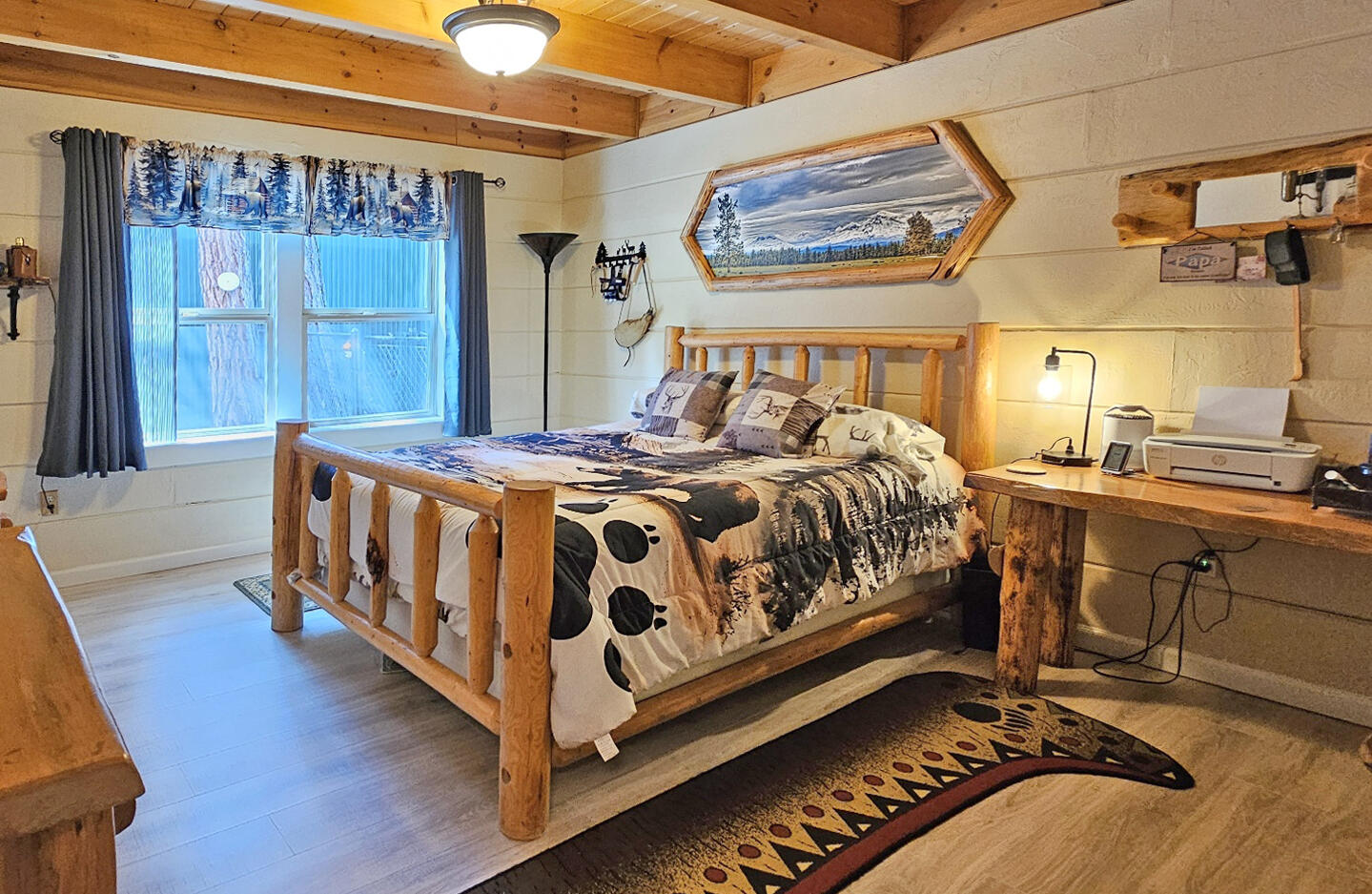 17659 Rosland Road La Pine, OR 97739 - Photo 14 of 33 a bedroom with a bed and wooden floor