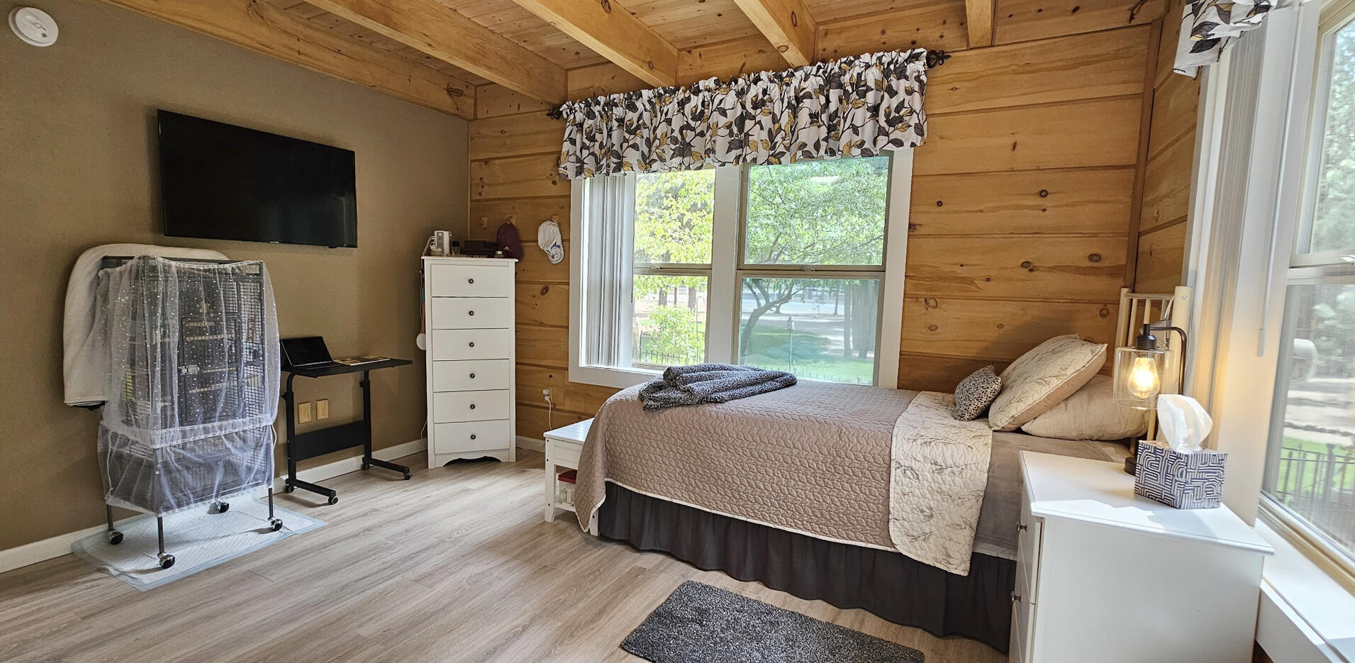 17659 Rosland Road La Pine, OR 97739 - Photo 17 of 33 a bedroom with a bed and wooden floor
