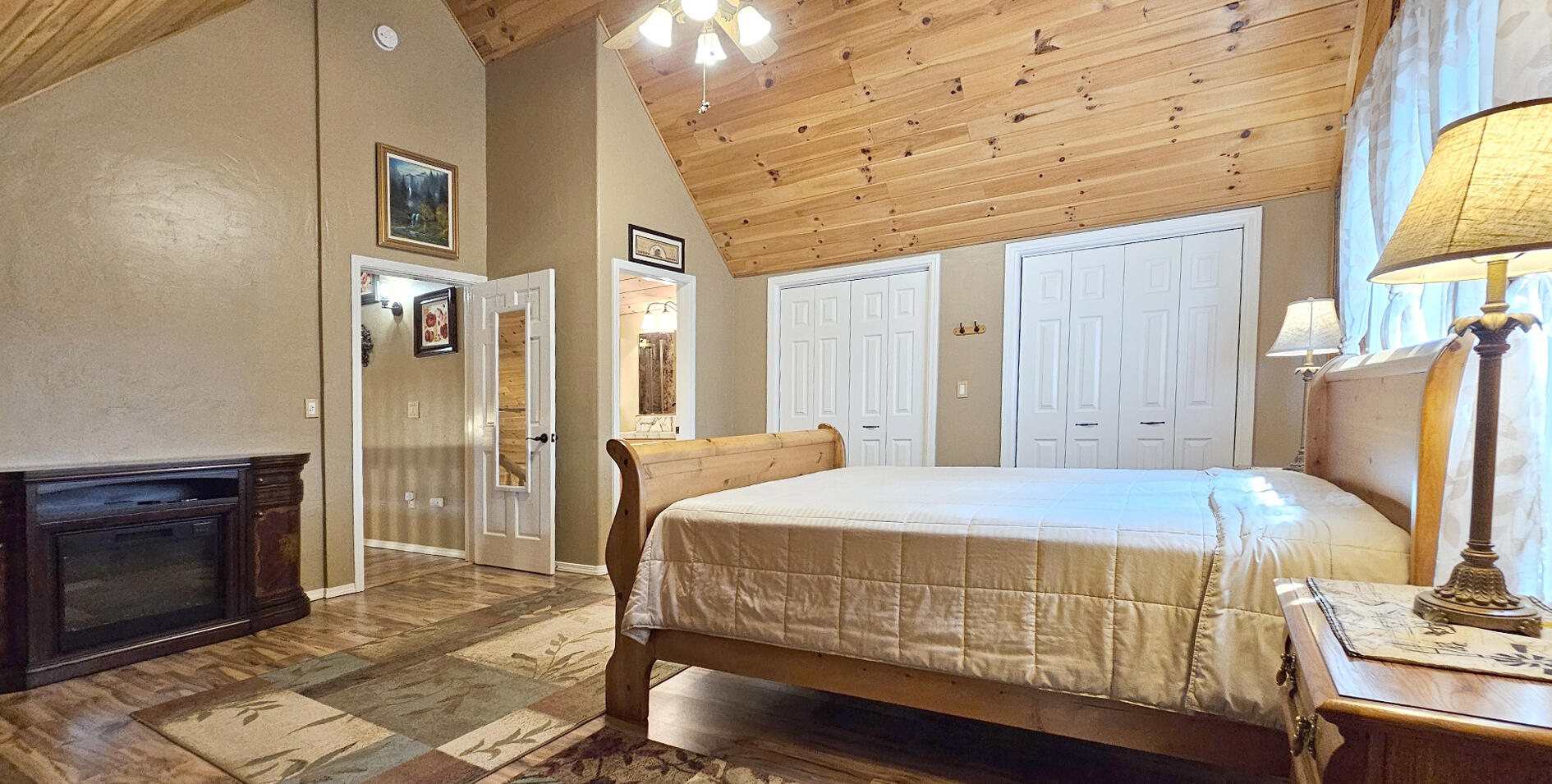 17659 Rosland Road La Pine, OR 97739 - Photo 20 of 33 a bedroom with a bed and a fireplace