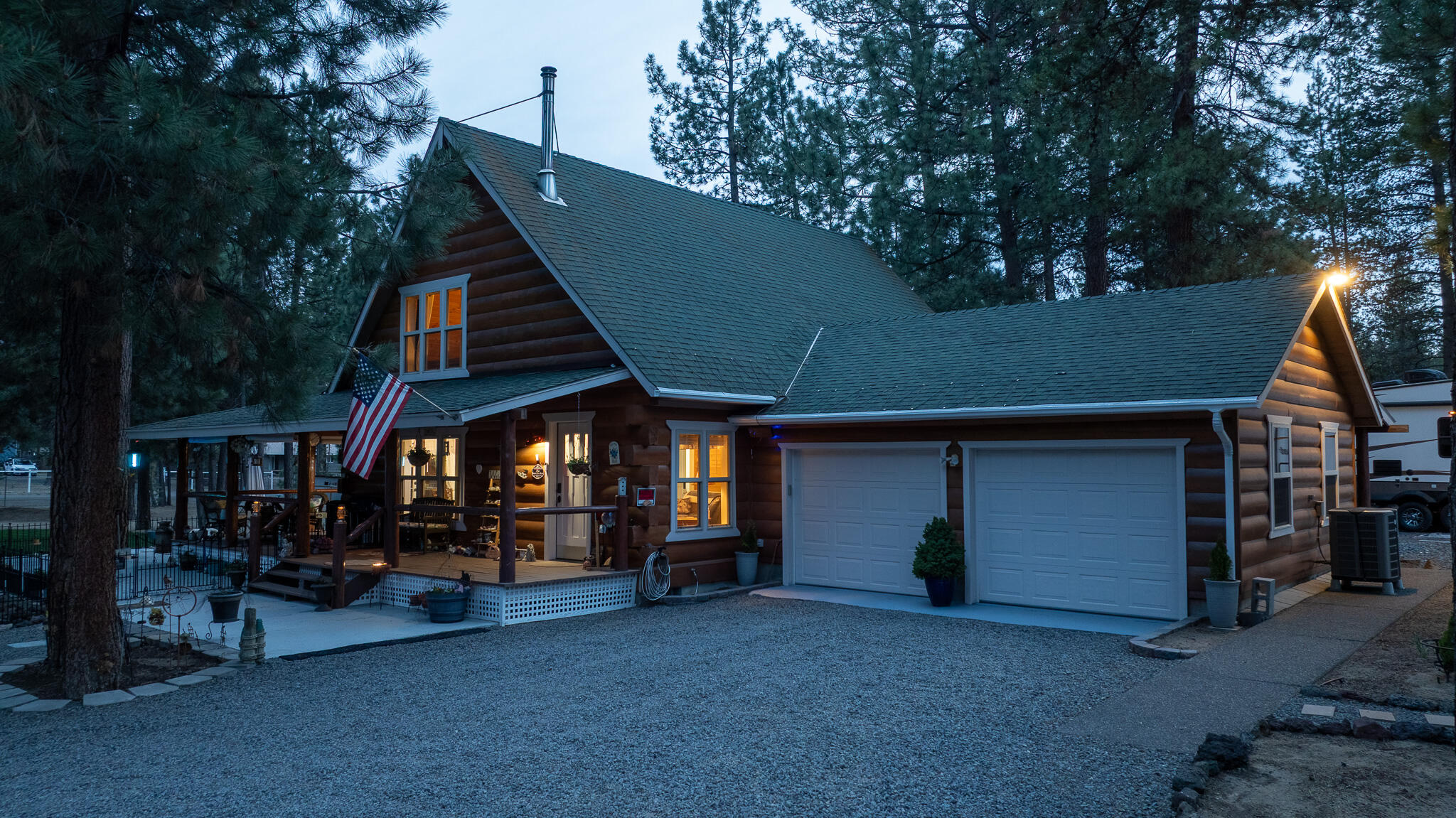 17659 Rosland Road La Pine, OR 97739 - Photo 30 of 33 a view of a house with a barbeque and large trees
