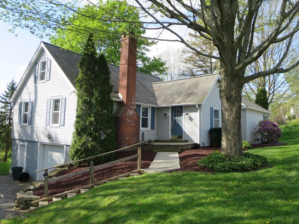 117 Stebbins Road Monson, MA 01057 - Photo 1 of 27 a view of a house with backyard and sitting area