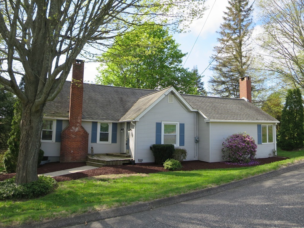 117 Stebbins Road Monson, MA 01057 - Photo 22 of 27 a front view of house with yard and trees around