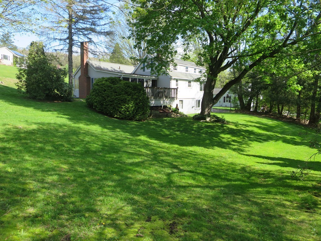 117 Stebbins Road Monson, MA 01057 - Photo 27 of 27 a view of a house with a big yard and large trees