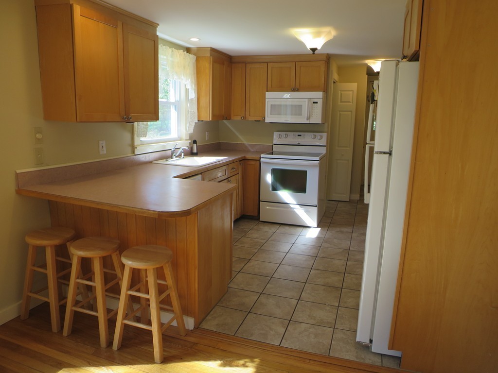 117 Stebbins Road Monson, MA 01057 - Photo 7 of 27 a kitchen with granite countertop a sink cabinets and stainless steel appliances