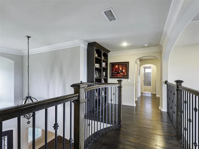 a view of gallery with wooden floor