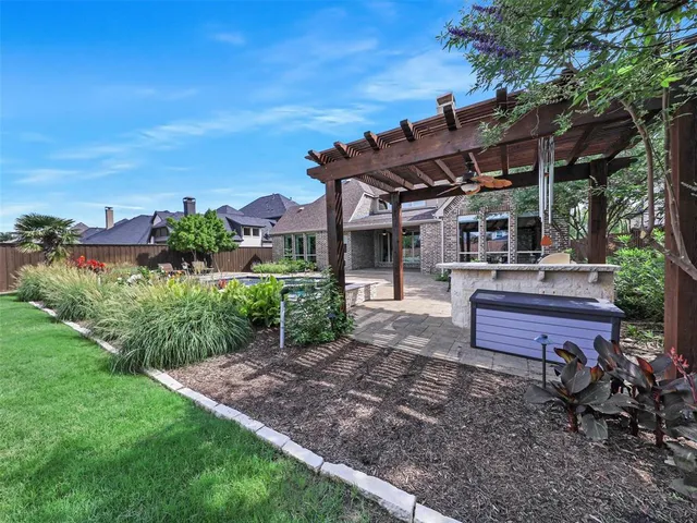 a view of a backyard with sitting area