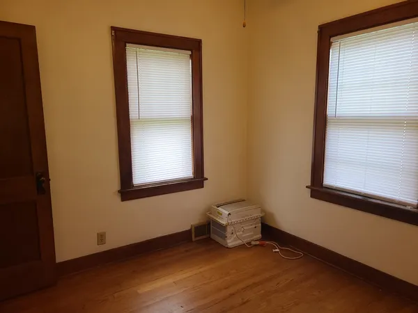a view of an empty room with a window