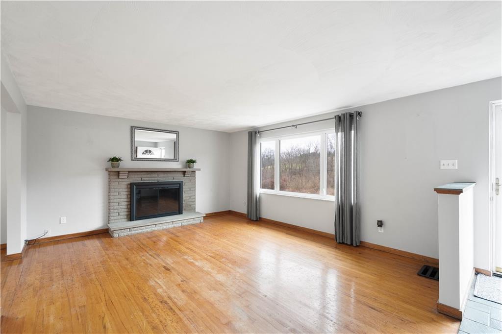 36 Swihart Road Canonsburg, PA 15317 - Photo 15 of 37 a view of empty room with wooden floor and fireplace