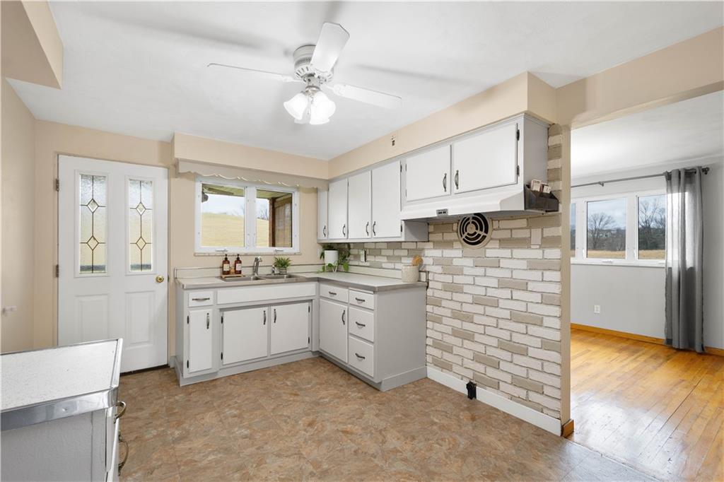 36 Swihart Road Canonsburg, PA 15317 - Photo 19 of 37 a kitchen with white cabinets and white appliances