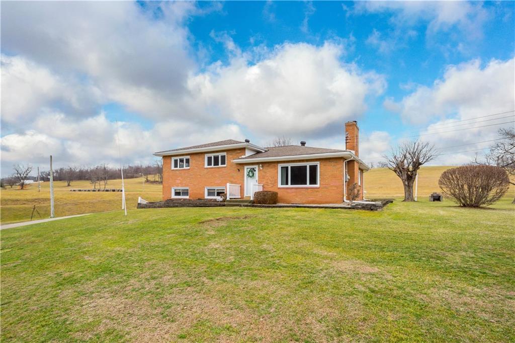 36 Swihart Road Canonsburg, PA 15317 - Photo 2 of 37 a front view of a house with a garden and lake view