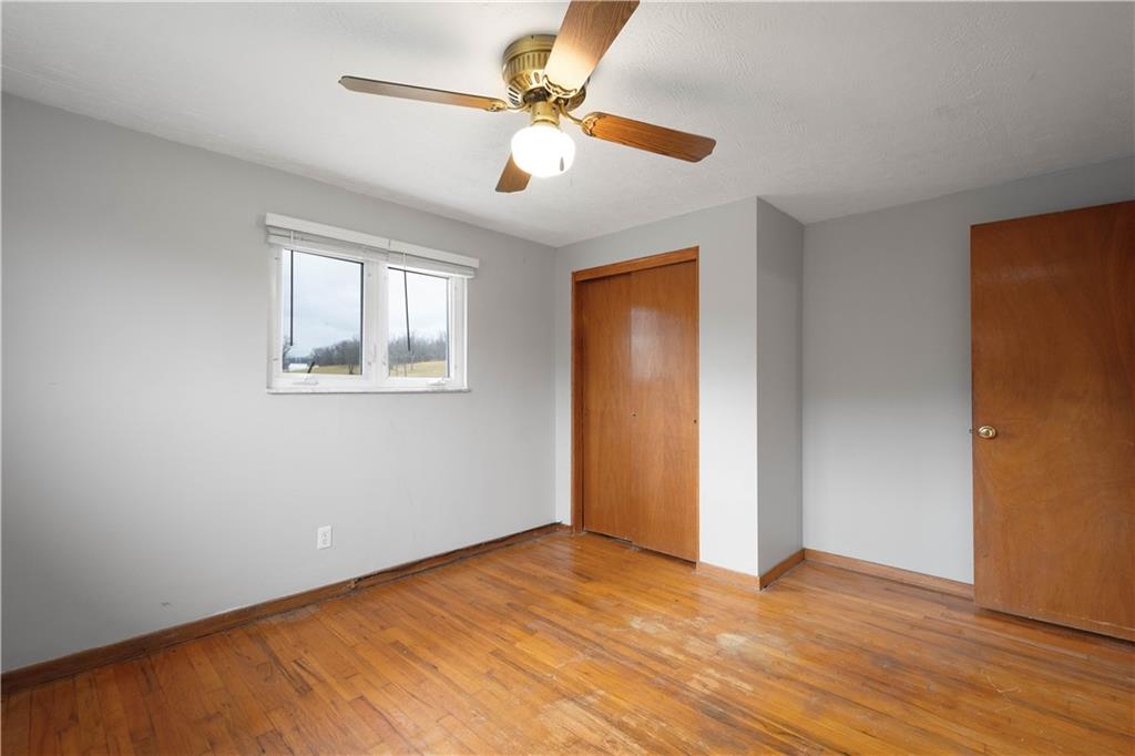 36 Swihart Road Canonsburg, PA 15317 - Photo 29 of 37 a view of an empty room with wooden floor and a window