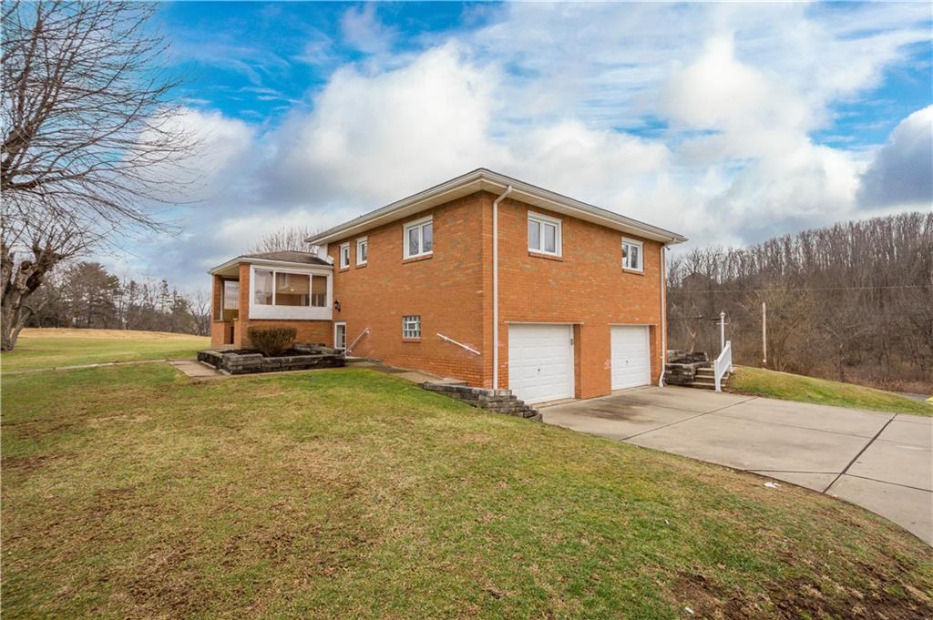 36 Swihart Road Canonsburg, PA 15317 - Photo 4 of 37 a front view of a house with a yard and garage
