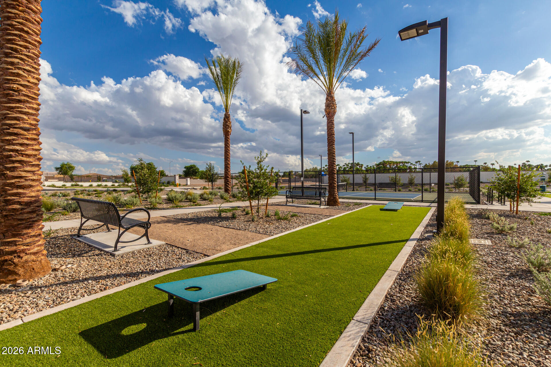 2626 East Russell Street Mesa, AZ 85213 - Photo 19 of 25 a view of a swimming pool with a lounge chair