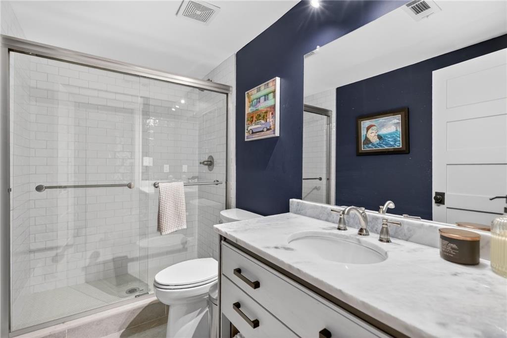 13460 New Providence Road Milton, GA 30004 - Photo 40 of 60 a bathroom with a sink toilet and shower