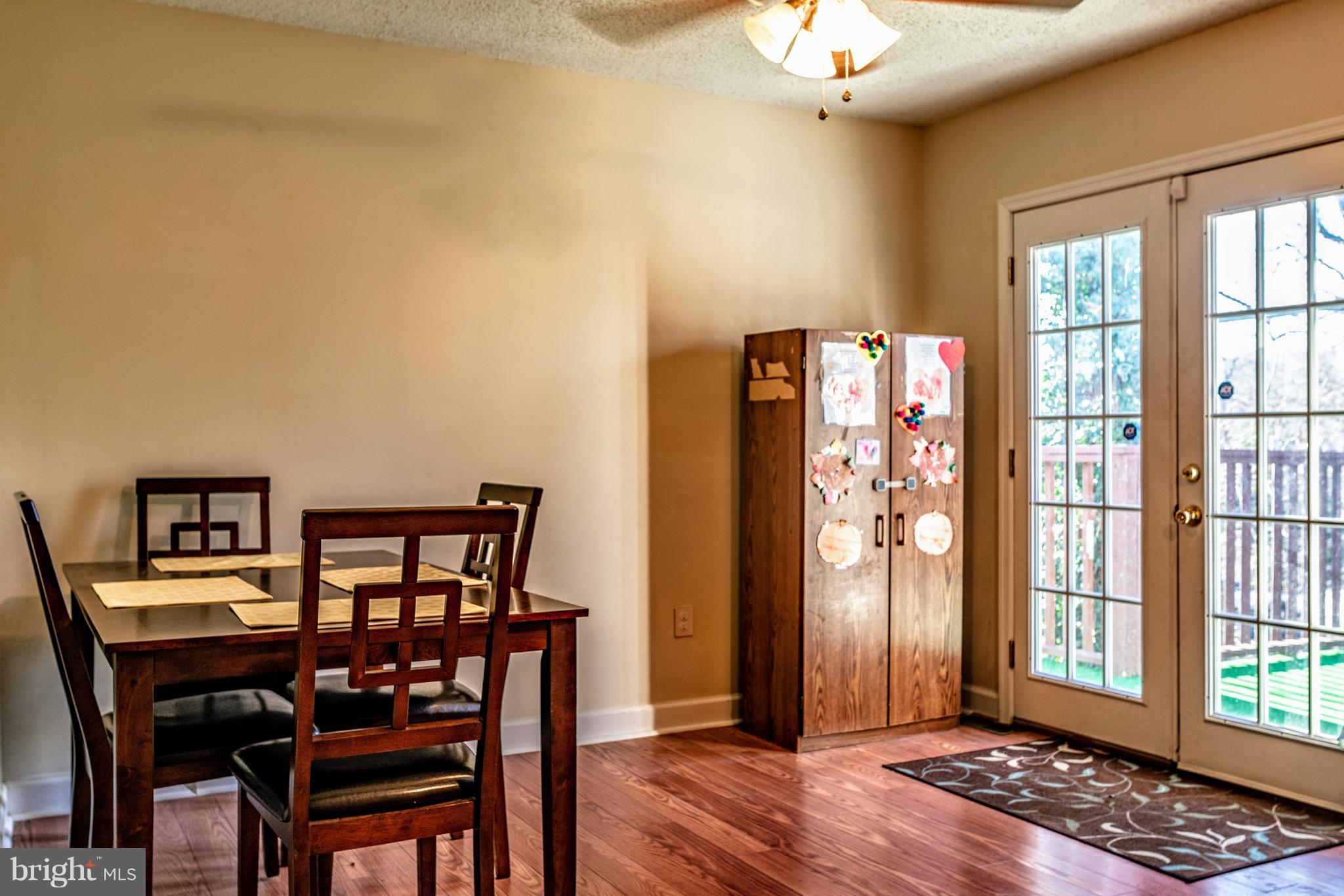 622 Running Fox Road Lusby, MD 20657 - Photo 12 of 46 Dining room with french door to wrapround deck