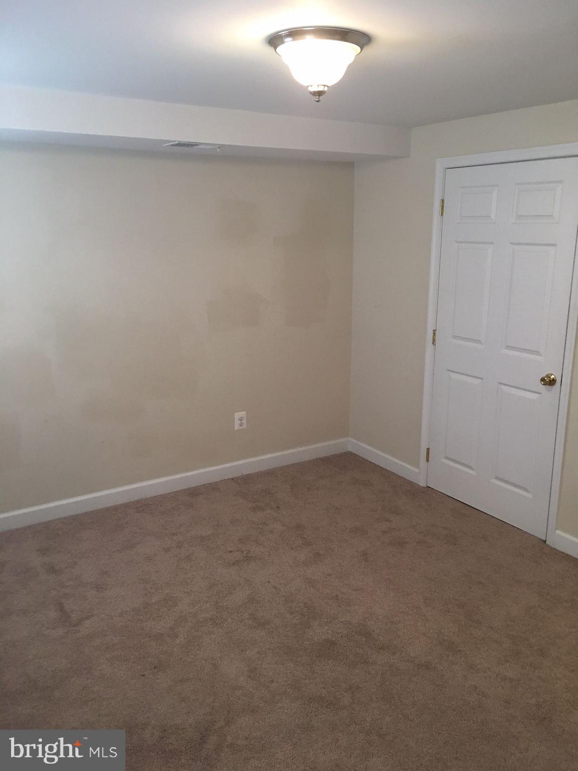 622 Running Fox Road Lusby, MD 20657 - Photo 22 of 46 More of the master bedroom with walk in closet