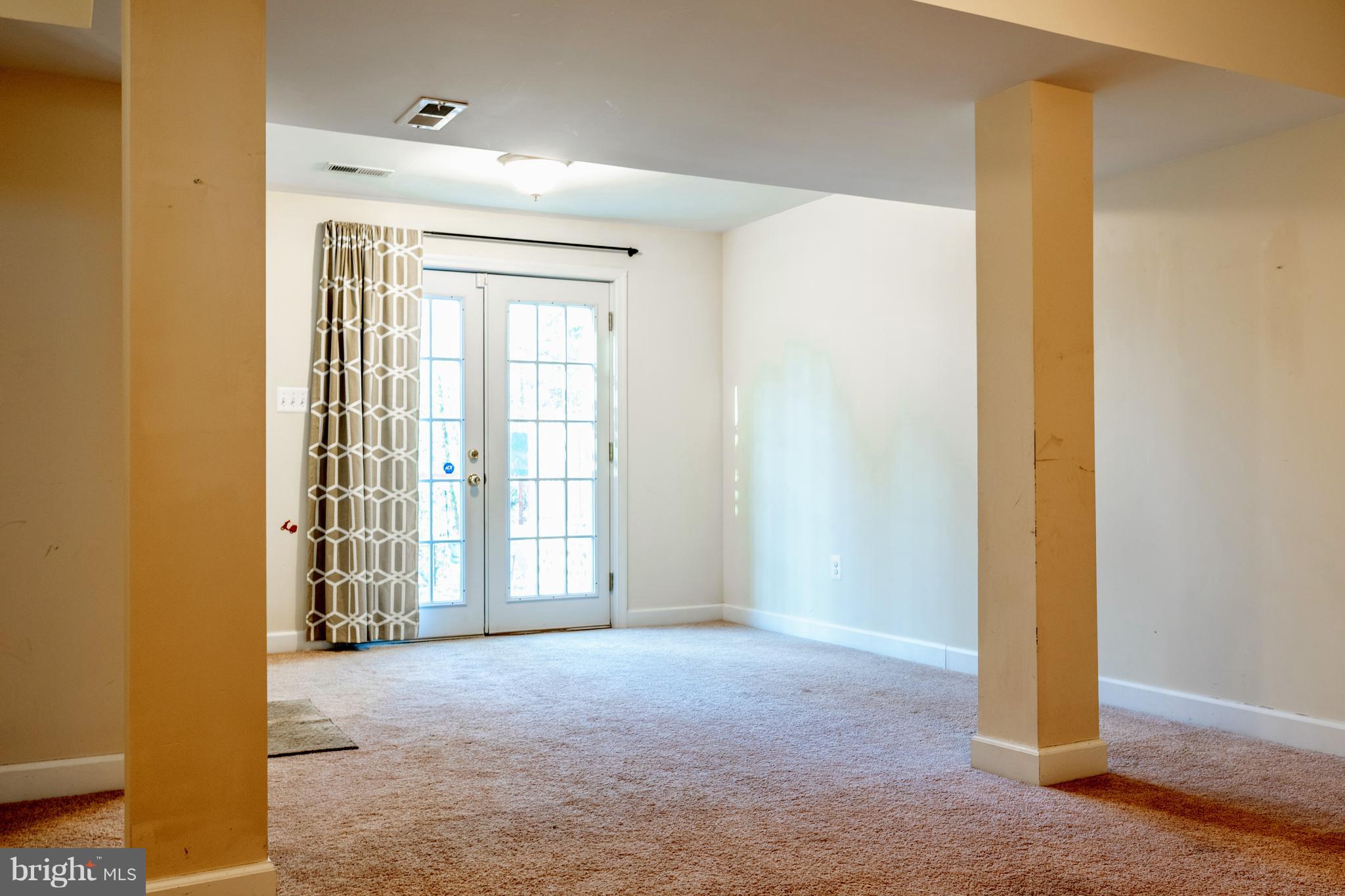 622 Running Fox Road Lusby, MD 20657 - Photo 25 of 46 Lower level family room with walk out french doors