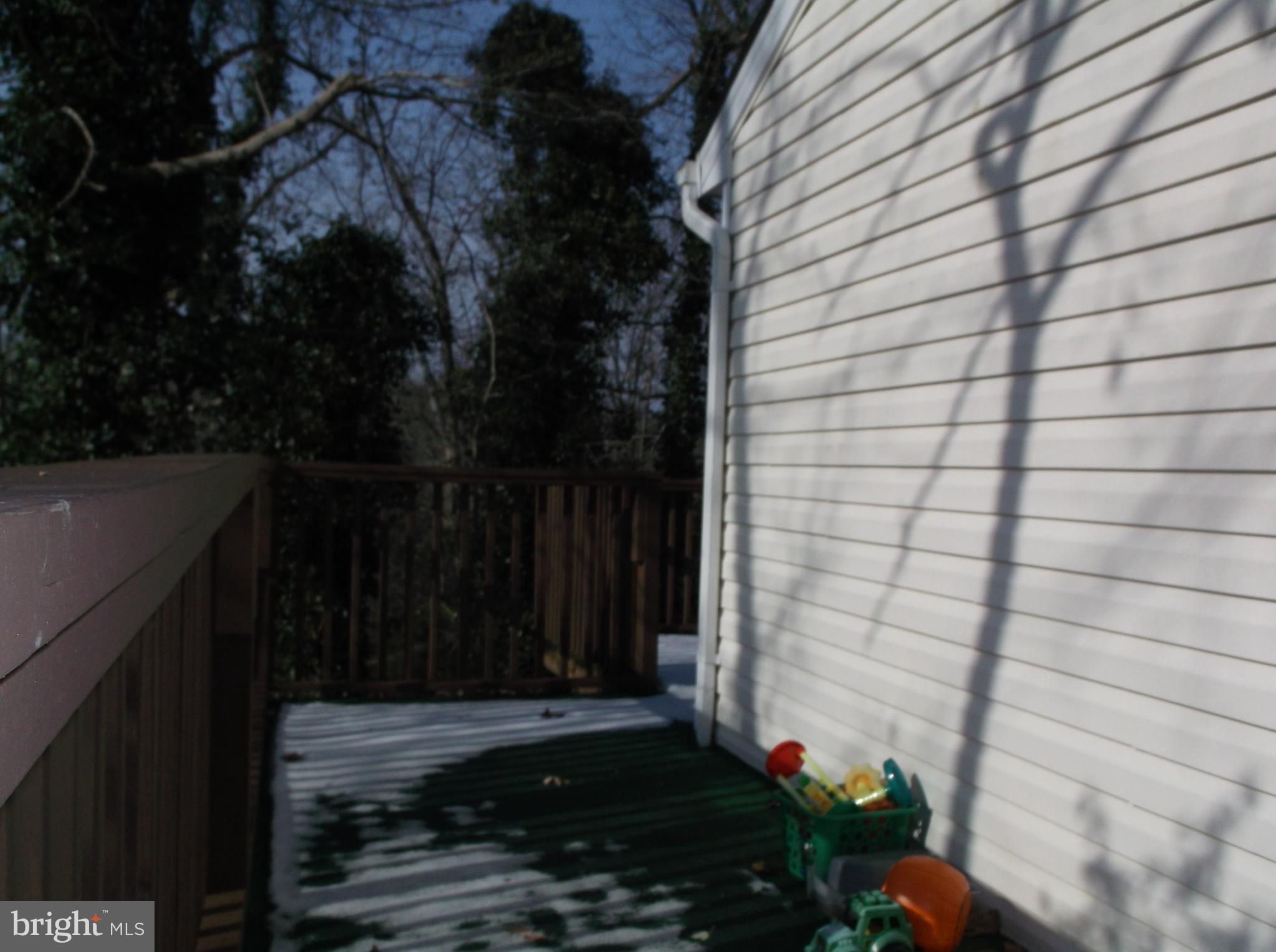 622 Running Fox Road Lusby, MD 20657 - Photo 31 of 46 Some of the side of the house and wrap around deck