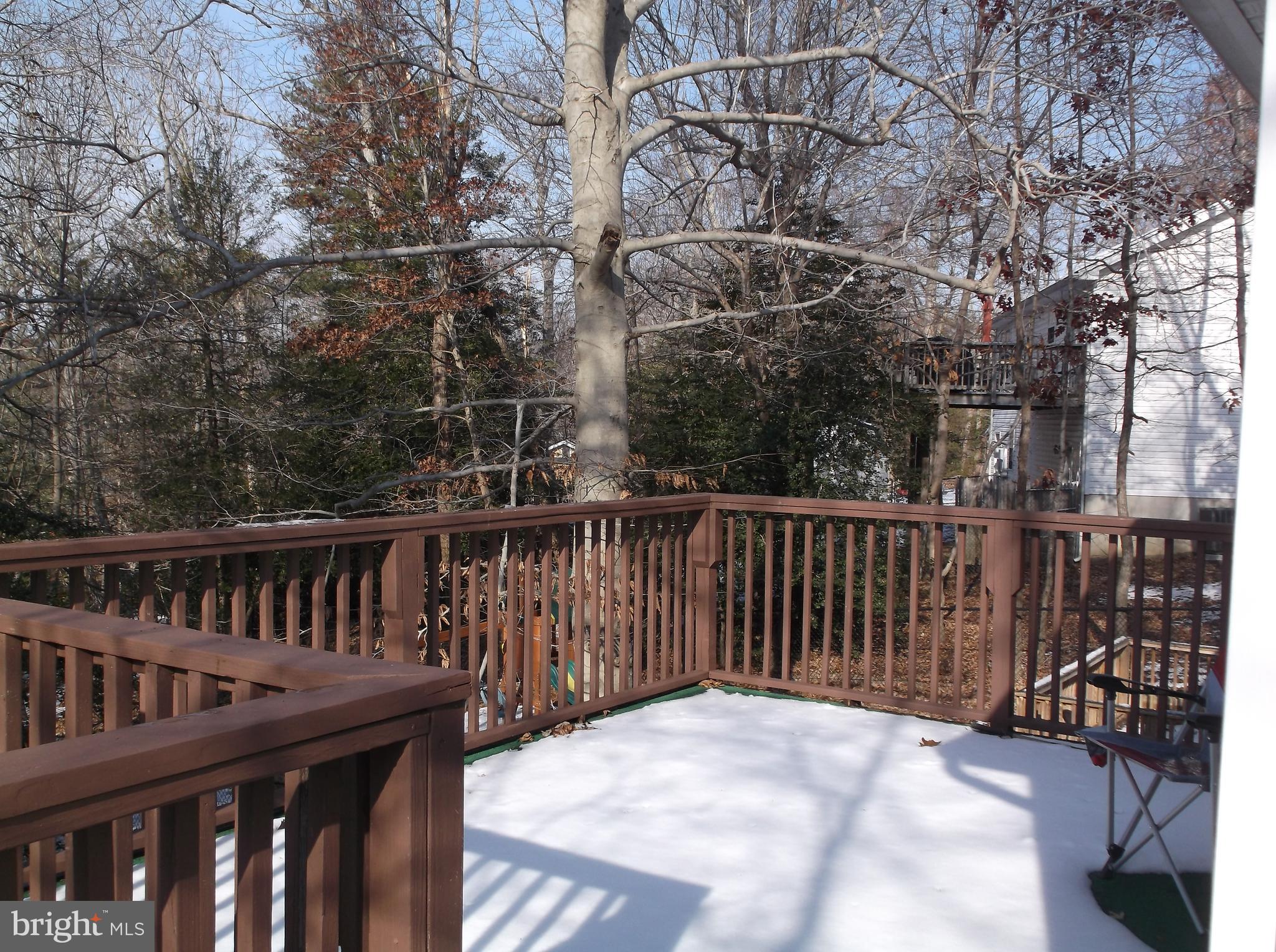 622 Running Fox Road Lusby, MD 20657 - Photo 33 of 46 Deck is large. Room for grill, table, & chairs