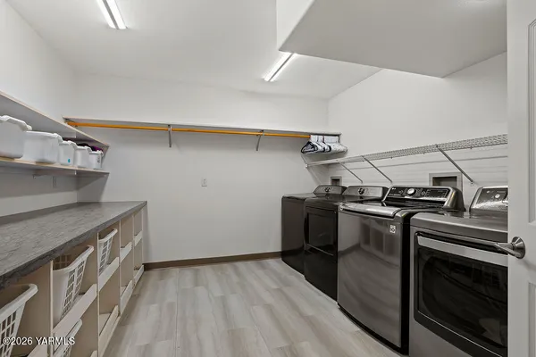 a view of a kitchen with storage and utility
