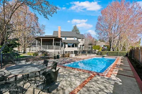 a view of a house with swimming pool