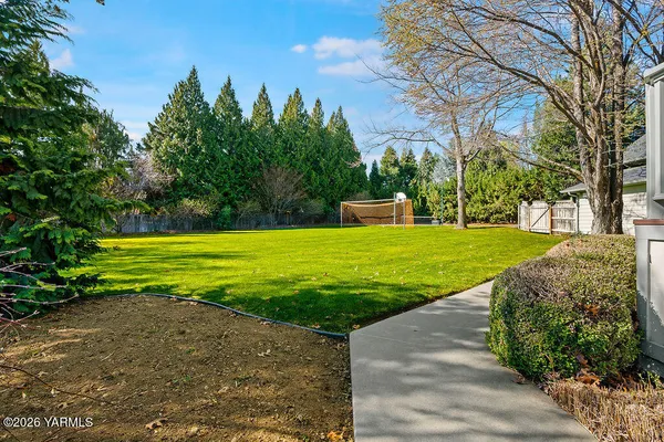 a view of a pool with a yard