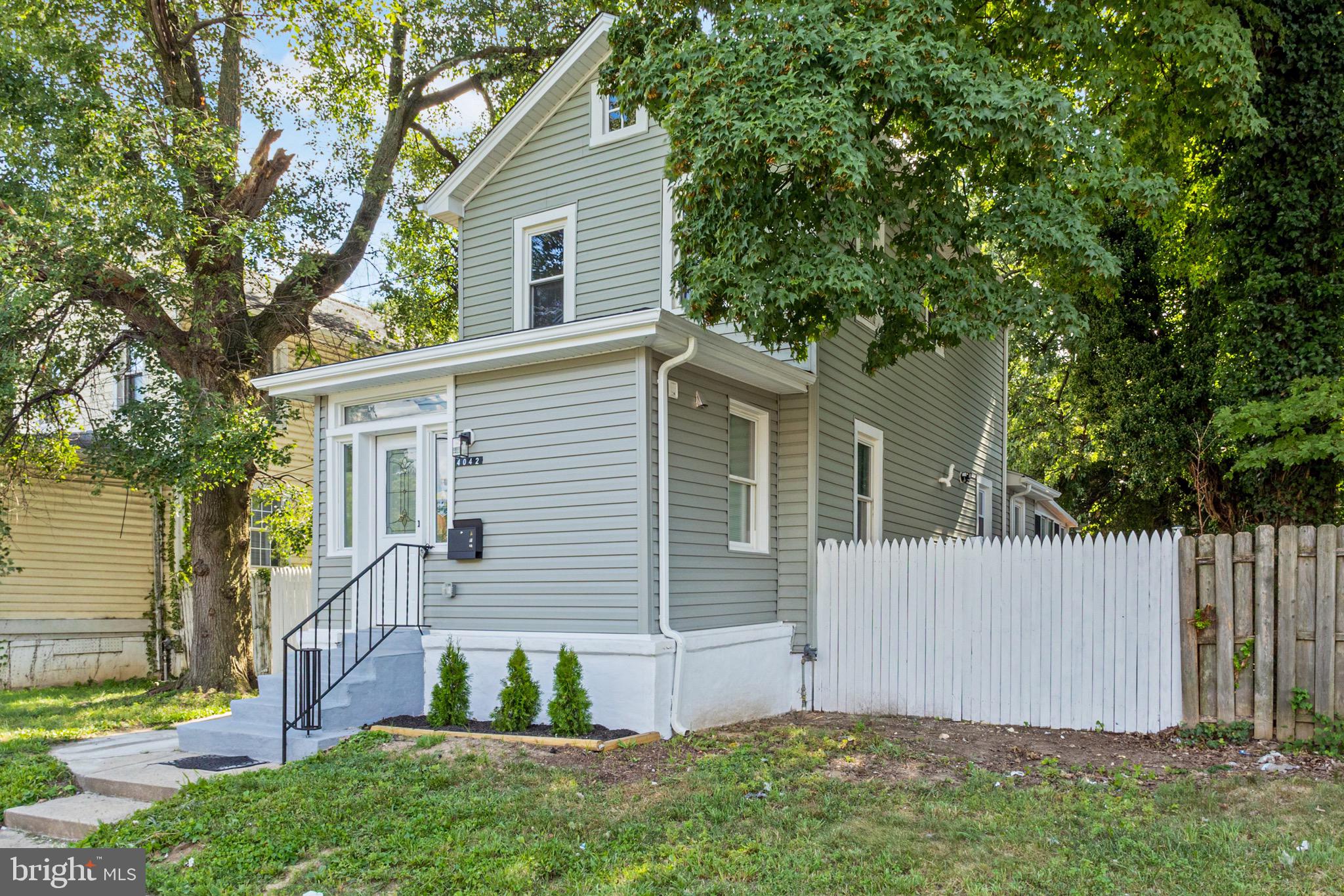 4042 6th Street Baltimore, MD 21225 - Photo 4 of 31 a view of backyard with small cabin and wooden fence